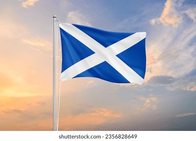 Scotland flag waving on sundown sky