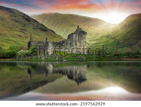 Scotland landscape - Kilchurn Castle with reflection in water at dramatic sunset