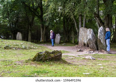 Scotland  - September 08 2019: Tourists Exploring Clava Cairns, A Bronze Age Burial Site Near Inverness, UK September 08,  2019