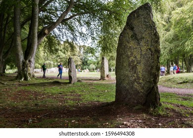 Scotland  - September 08 2019: Tourists Exploring Clava Cairns, A Bronze Age Burial Site Near Inverness, UK September 08,  2019