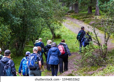 Scotland  - September 09 2019: Group of walkers exploring the Scottish Highlands in the Cairngorm National Park, UK September 09,  2019 - Shutterstock ID 1594853362