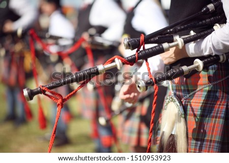 Scottish bagpipe marching band close up on bagpipes