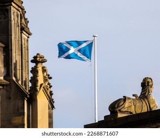 The Scottish flag, flying proudly in the old town area of Edinburgh, Scotland, UK.