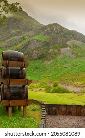 Scottish Highlands And Barrels Filled With Whiskey