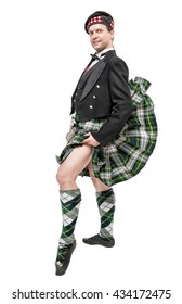 Scottish Man In Traditional National Costume With Blowing Kilt Isolated