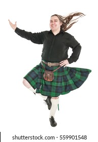 Scottish Man In Traditional National Costume With Blowing Kilt Isolated