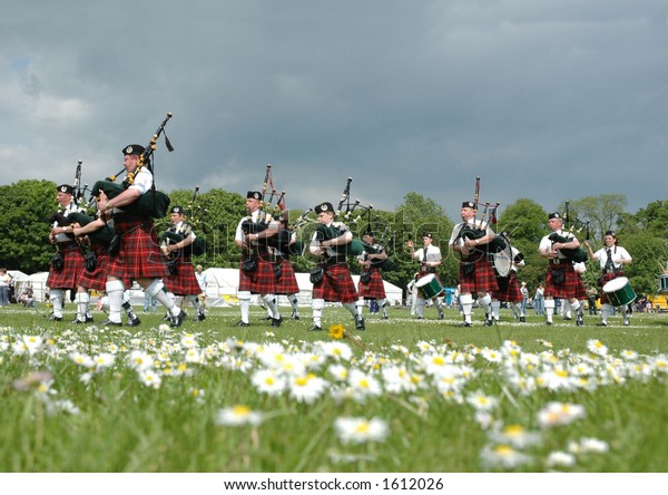 Scottish Pipe Band Marching On Grass Stock Photo (Edit Now) 1612026