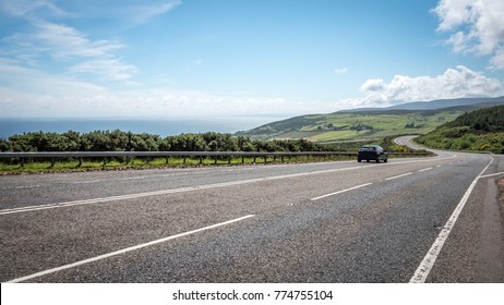 Scottish road trip. A view south along the arterial A9 road north of Helmsdale in the north east of Scotland. The road is one of the most northerly A roads on the British mainland. - Powered by Shutterstock