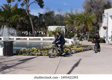 Scottsdale AZ/ USA 02/10/2019 Couple Riding A Bike In Scottsdale Arizona 