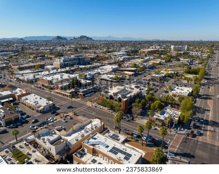 Scottsdale city center aerial view on Scottsdale Road at Indian School Road at the background in city of Scottsdale, Arizona AZ, USA. 