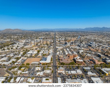 Scottsdale city center aerial view on Scottsdale Road at Main Street with Arizona Canal and Camelback Mountain at the background in city of Scottsdale, Arizona AZ, USA. 