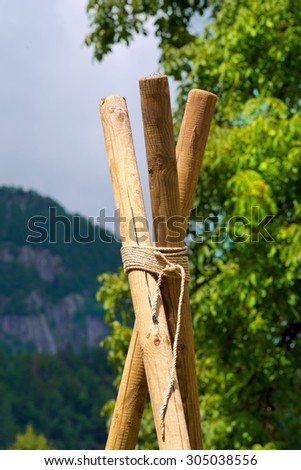 Scout Construction with Poles and Ropes / Detail of a Scout construction with three wooden poles and ropes