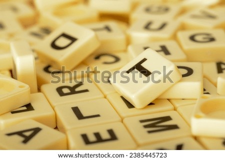 Scrabble letters in an educational context can make learning the ABCs more engaging and interactive for young students.