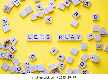 Scrabble Letters On Yellow Background Spelling Words LETS PLAY