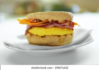 Scrambled Egg, Black Forest Ham And Cheddar Cheese On A Whole Wheat English Muffin