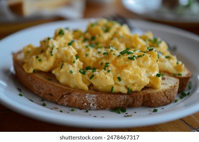 scrambled egg on toasted bread gourmet cooking served on a plate - Powered by Shutterstock