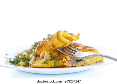 Scrambled Eggs With Fresh Herbs On A White Background