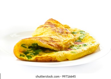 Scrambled Eggs With Fresh Herbs On A White Background