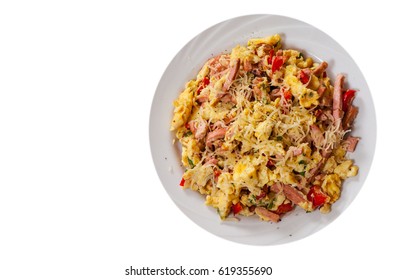 Scrambled Eggs With Ham, Vegetables And Cheese In A Plate. Top View. Isolated On White