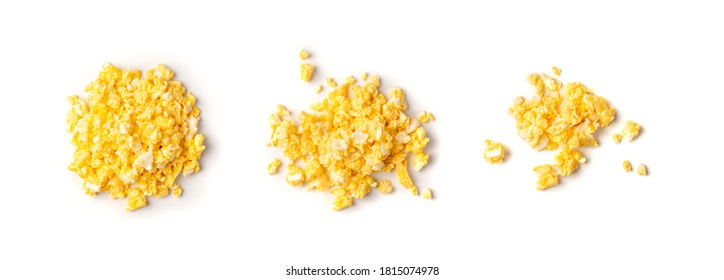 Scrambled eggs or omelet isolated on white background. Breakfast fried eggs stirred or beaten together with salt and butter. Morning hot omelette, fresh omlet top view