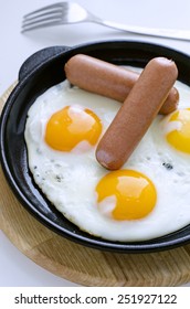 Scrambled Eggs And Sausage In A Cast Iron Skillet For Breakfast