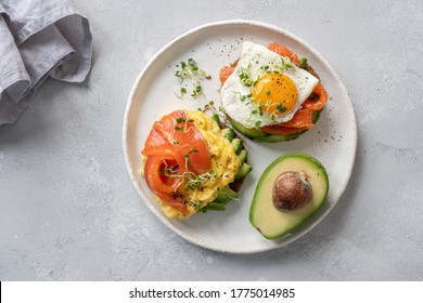 Scrambled eggs with smoked salmon and avocado on toast , Breakfast food
