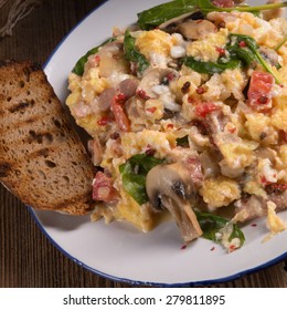 Scrambled Eggs With Tomatoes And Spinach