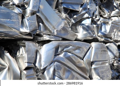 Scrap Aluminium Pressed Together For Melting And Recycling. 