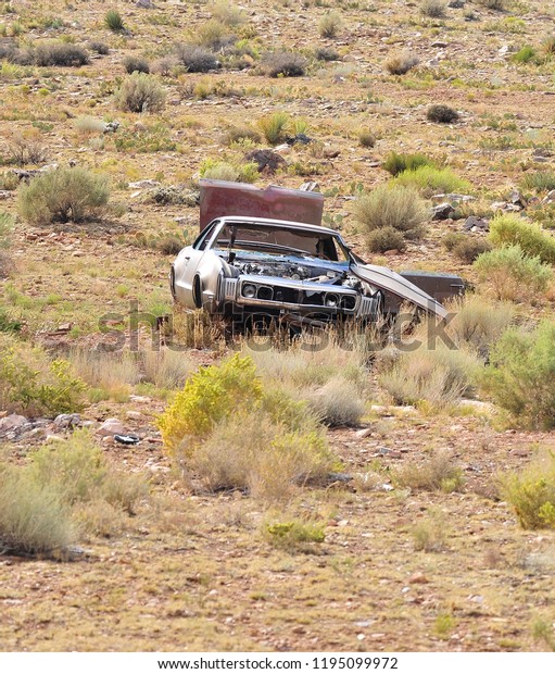 scrap car in the\
desert