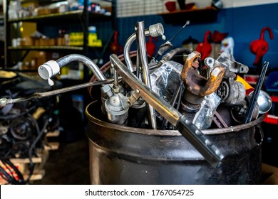 Scrap Metal For Junk Removal In A Mechanic Automobile Repair Shop. Car Parts For Recycling Metal.