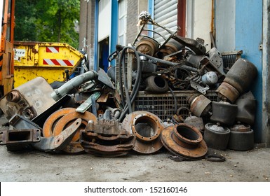 Scrap metal, old car parts in a garage