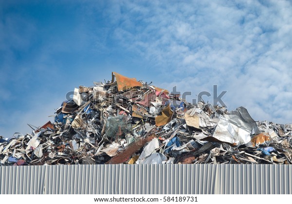 Scrap metal on recycling\
plant site.