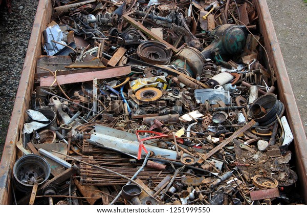 Scrap metal in railway cars.. Scrap yard, metal\
rubbish stock.
