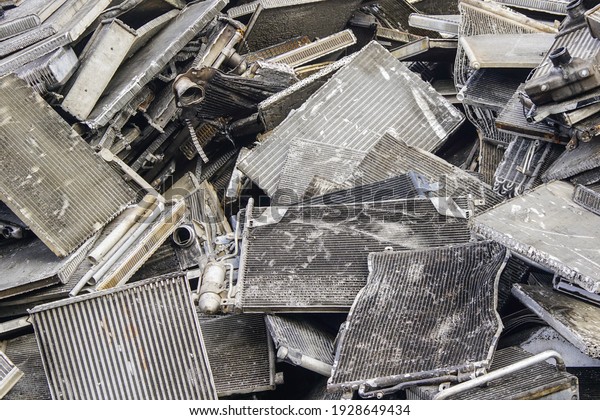 scrap\
pile of old used car aluminum cooling\
radiators