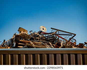Scrap piles of scrap metal for recycling in a scrap yard - Shutterstock ID 2298563971