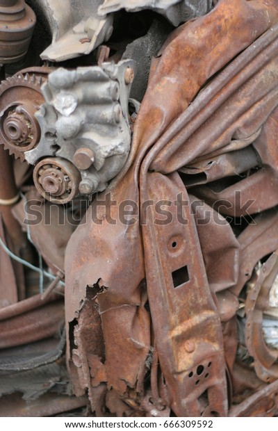 Scrap rusty metal, crushed\
cars.
