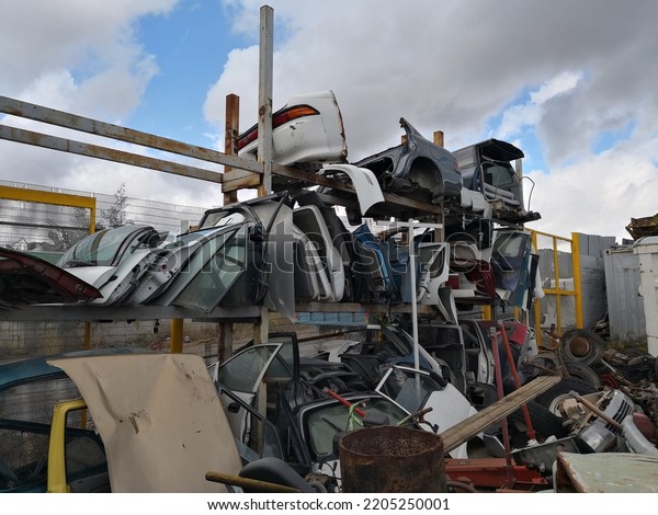 The scrap yard\
with old cars of crushed\
cars