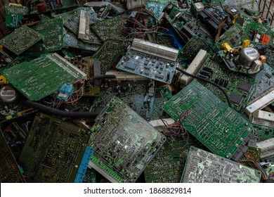 Scrap yard printed circuit board electronic waste for recycling with selective focus. main board electronic waste - Powered by Shutterstock