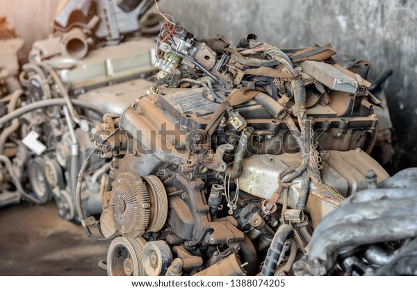 Scrap yard for recycle the engine and\
automotive parts. Engine junkyard. That old, cracked engine block.\
Metal recycling yard. Scrap metal recycling\
yard