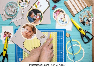scrapbook background. the process of creating a childrens album. Card and tools with decoration 