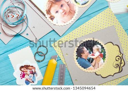 scrapbook background. the process of creating a childrens album. Card and tools with decoration 