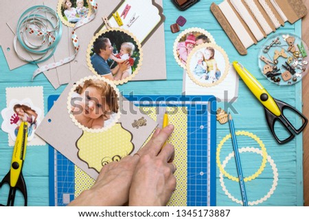 scrapbook background. the process of creating a childrens album. Card and tools with decoration 