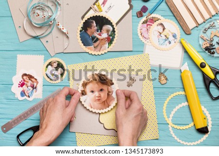 scrapbook background. the process of creating a childrens album. Card and tools with decoration 