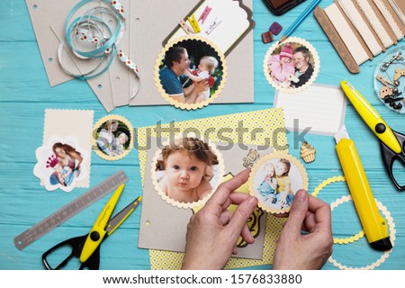 scrapbook background. the process of creating a childrens album. Card and tools with decoration 