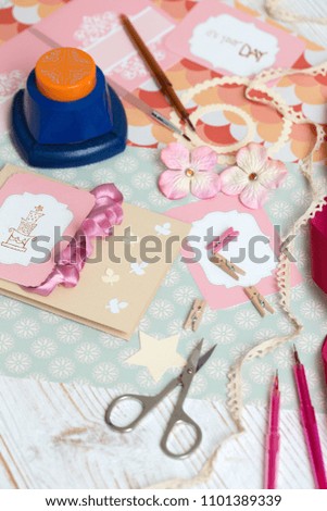 scrapbook background. process of creating a postcard - Card and tools with decoration 