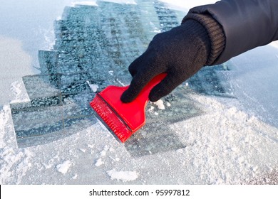 Scraping Ice From The Car Window