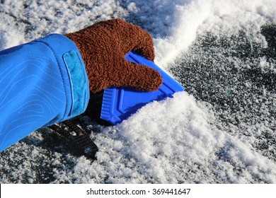 Scraping Ice Off The Windshield