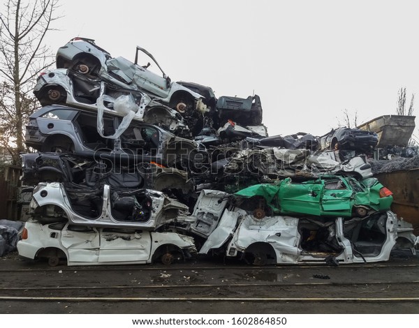 Scrapped crushed cars in\
recycling site 