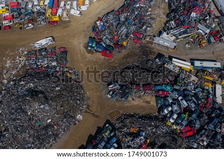 Scrapyard Aerial View. Old rusty corroded cars in car junkyard. Car recycling industry from above. 
