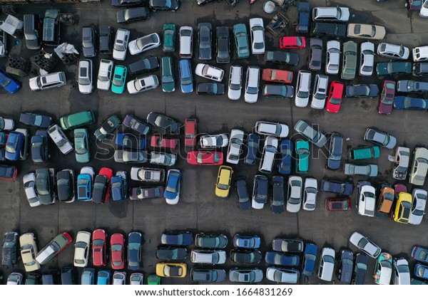 Scrapyard\
with broken cars from above. The junk yard was photographed with a\
drone. Frankfurt, Hessen/Germany -\
25.01.20.